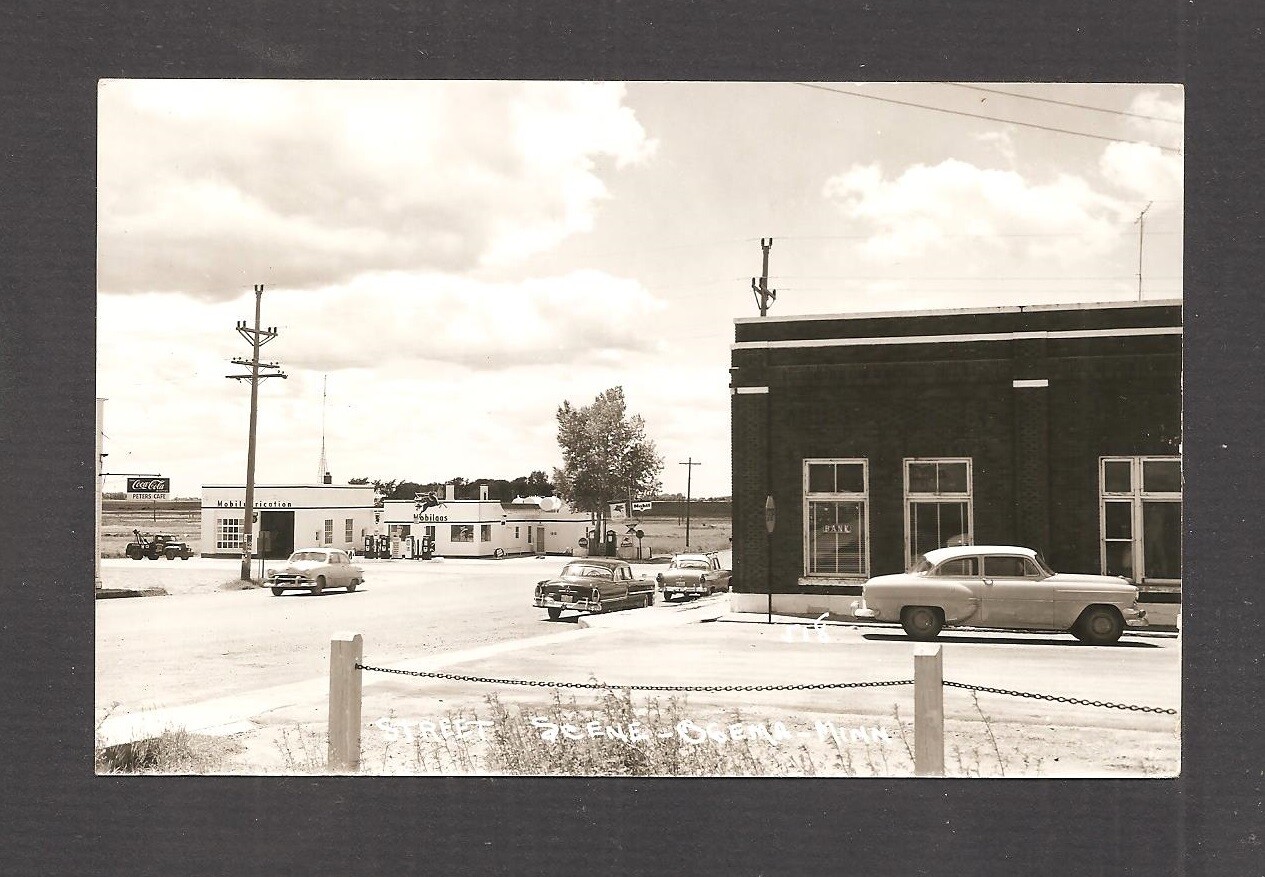 REALPHOTO POSTCARD STREET SCENE OGEMA, MINNESOTA MOBILE GAS