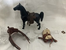 Saddle And Toy Horse Lot
