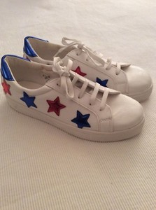 white leather sneakers with stars