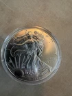 2014 $1 SILVER EAGLE = 1 OZ. .999 SILVER = U. S. MINT = UNCIRCULATED IN CAPSULE