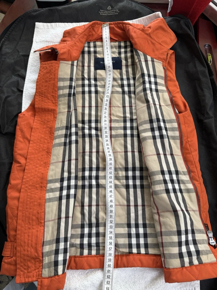 Hermoso chaleco acolchado Burberry para mujer forro a cuadros talla S naranja/azafrán/rojo Foto 2 de 4