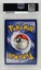 PSA 7 NEAR MINT Pokémon 1st Edition Base Set double colorless energy card with silver ball on blue-yellow border.