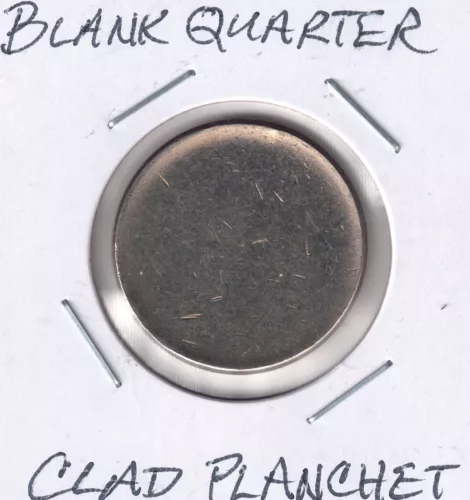 Blank Washington quarter clad planchet. Mint error, was not to be released. (#1)