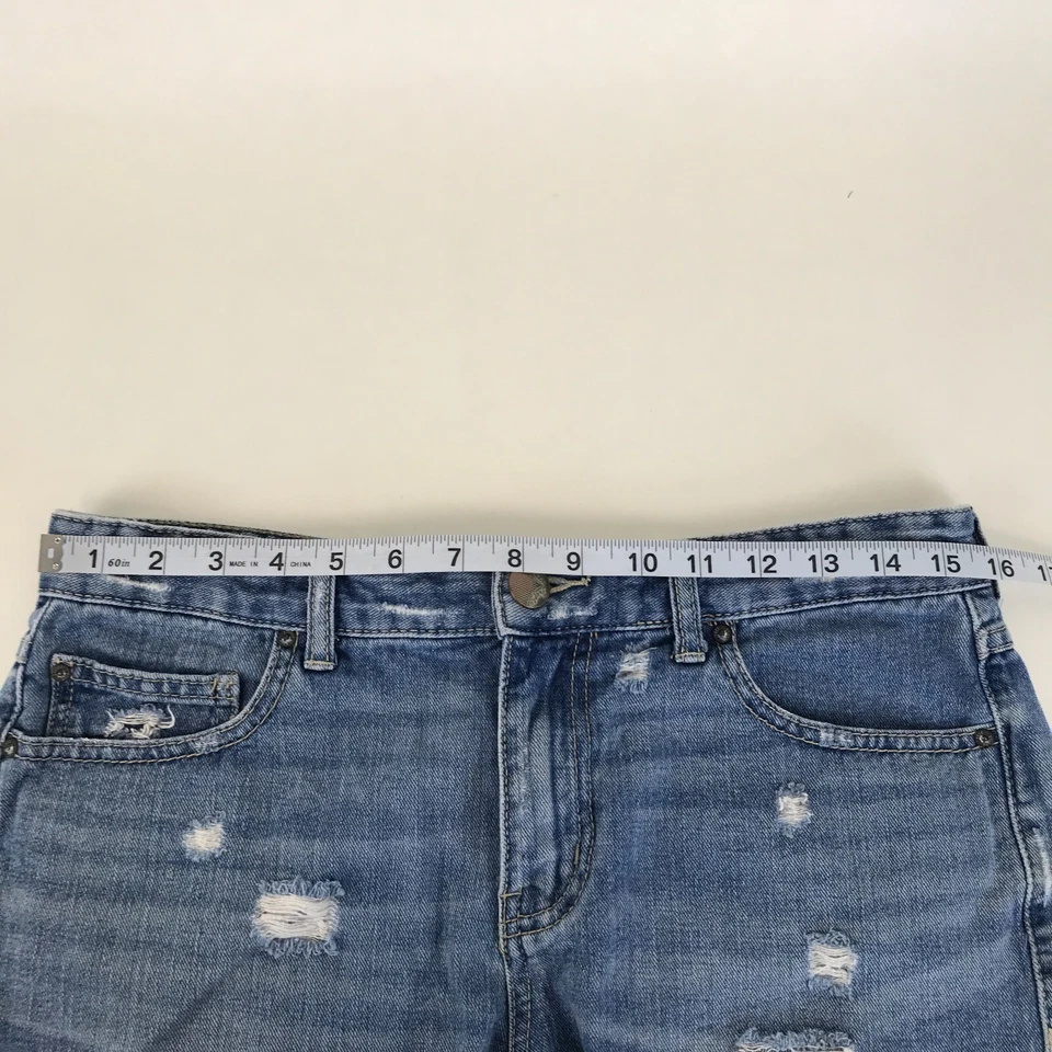 Pantalones cortos de mezclilla desgastados de cintura alta Free People para mujer talla 28 bolsillos con dobladillo crudo Foto 4 de 4