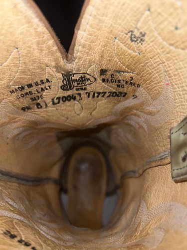 Tan ostrich leather Justin L7004 cowboy boot with black square toe, labeled “Made in U.S.A.” and “Registered No. 9.5B.”