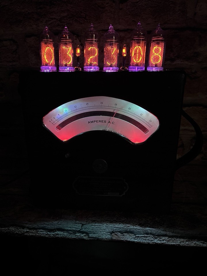 A working Nixie tube clock built *inside* a refinished vintage Weston voltmeter — industrial upcycling at its most jaw-dropping.