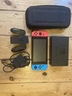 Nintendo Switch with controllers, dock, charger and case