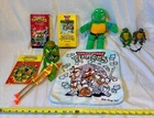 VTG TMNT Lot Of 9 2 VCR Tapes Figures Gun Book Topper Plush Washcloth