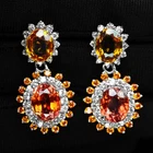 FANTA ORANGE SAPPHIRE OVAL 12.10CT 925 STERLING SILVER WHITE GOLD HALO EARRINGS