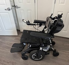 Invacare electric wheelchair With tilt features  caregiver controls.