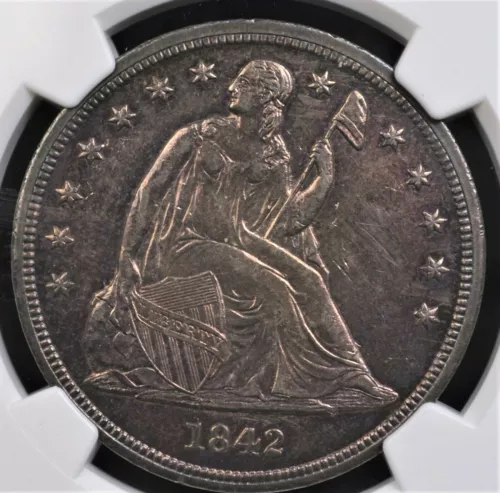 1842 SEATED LIBERTY DOLLAR NGC MS 61 GLASSY REFLECTIVE GRAPE AND VIOLET INFUSED