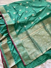 Beautiful teal-green silk saree dress with golden accents