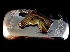 Horse belt buckle with floral decoration