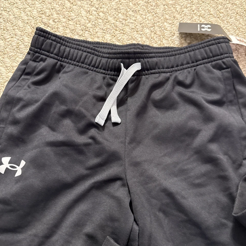 Pantalones cónicos Under Armour Pitch gris/negro UA Brawler 2.0 para niños jóvenes medianos Foto 2 de 4