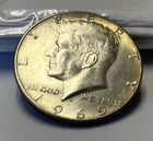 1969-D Kennedy Half Dollar 40% Silver - AU About Uncirculated.