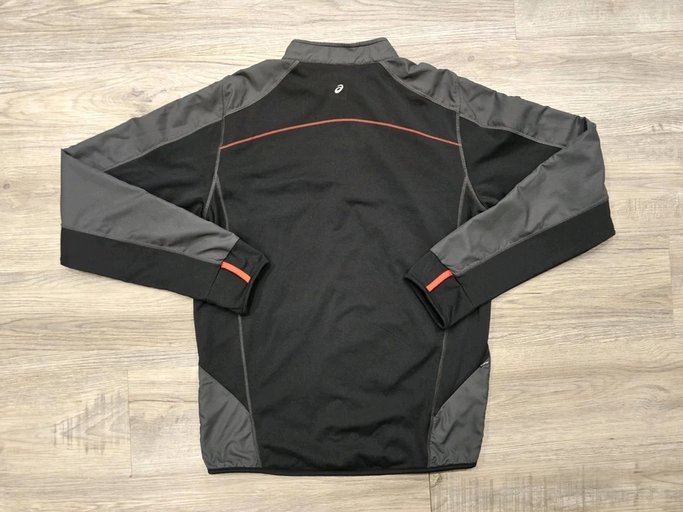Chaqueta Atlética Asics Mujer Grande Negra Gris Ultra Corredor Cremallera Completa Bolsillo Elástico Foto 2 de 4