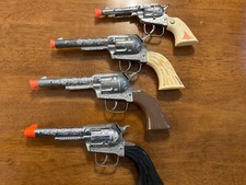Three Pony Boy Diecast and one Indian Head Diecast Metal Toy Cap Pistols