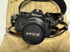 Nikon EM 35mm SLR Film Camera With 50mm Lens Plus 52mm Filter Extra Lens Bag