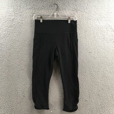 Athleta Salutation Stach Pocket II Capri Legging Womens M Black Mid Rise Pull On