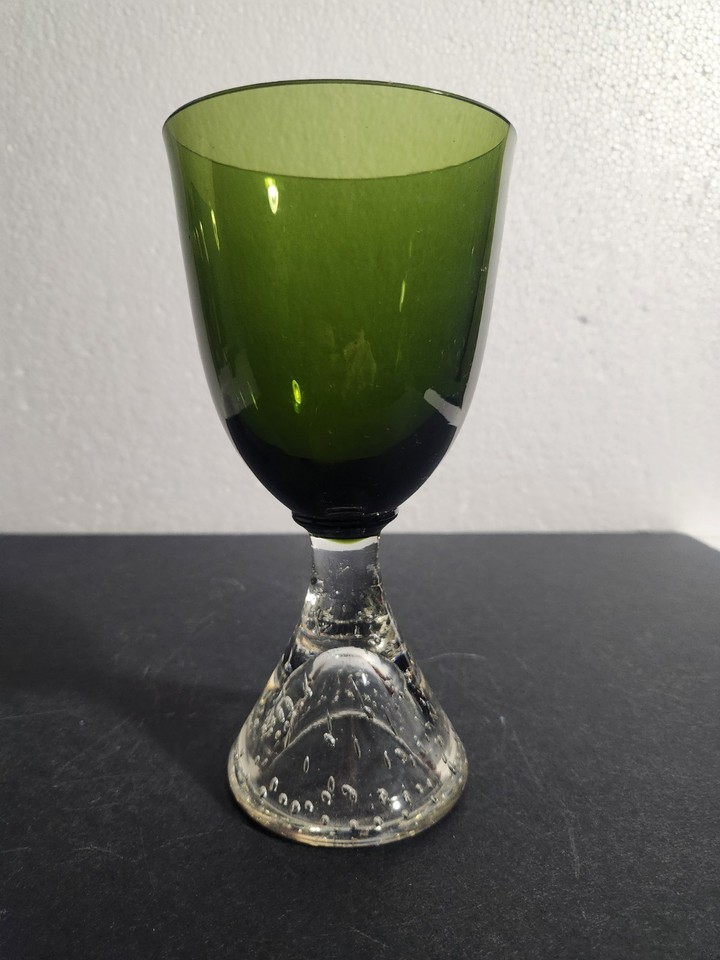 That dreamy avocado green with a clear bubble glass stem is pure 1970s retro charm — heavy, rare, and visually striking on any bar cart.