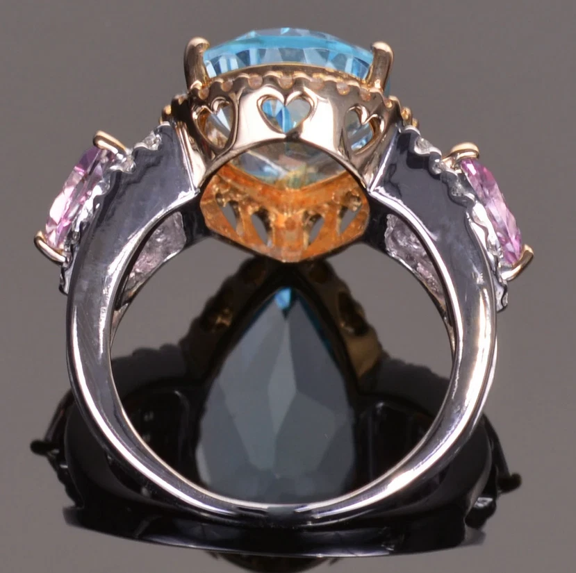Featuring a Pear-Shaped 7.18CT Swiss Blue Topaz, Two Pink Ruby & White CZ Ring - Image 2 of 4