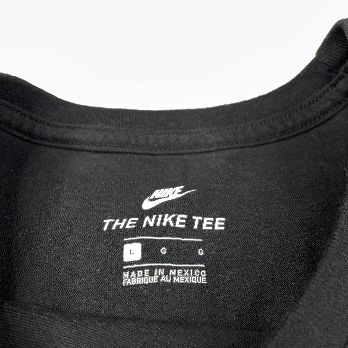 broken nike swoosh shirt