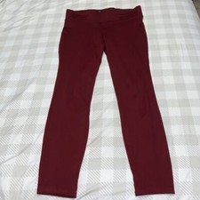 Size Medium red leggings by Dictionary