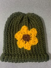 Hand-crocheted hat with flower.SIZE CHILD W 6 1/2 in x H 7 1/2 in FREE SHIP