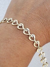 Womans diamond cut 14k yellow gold hearts Bracelet 7.25"