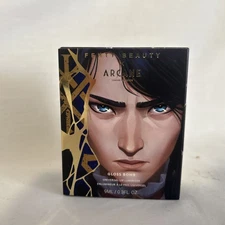 Fenty Beauty x Arcane Rogue On Riche$ Gloss Bomb Universal Lip Luminizer In Hand