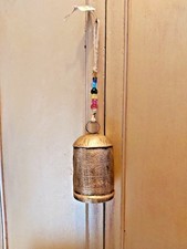 HANDMADE ETCHED METAL INDIAN COW BELL ON A THICK JUTE ROPE WITH COLOURED BEADS