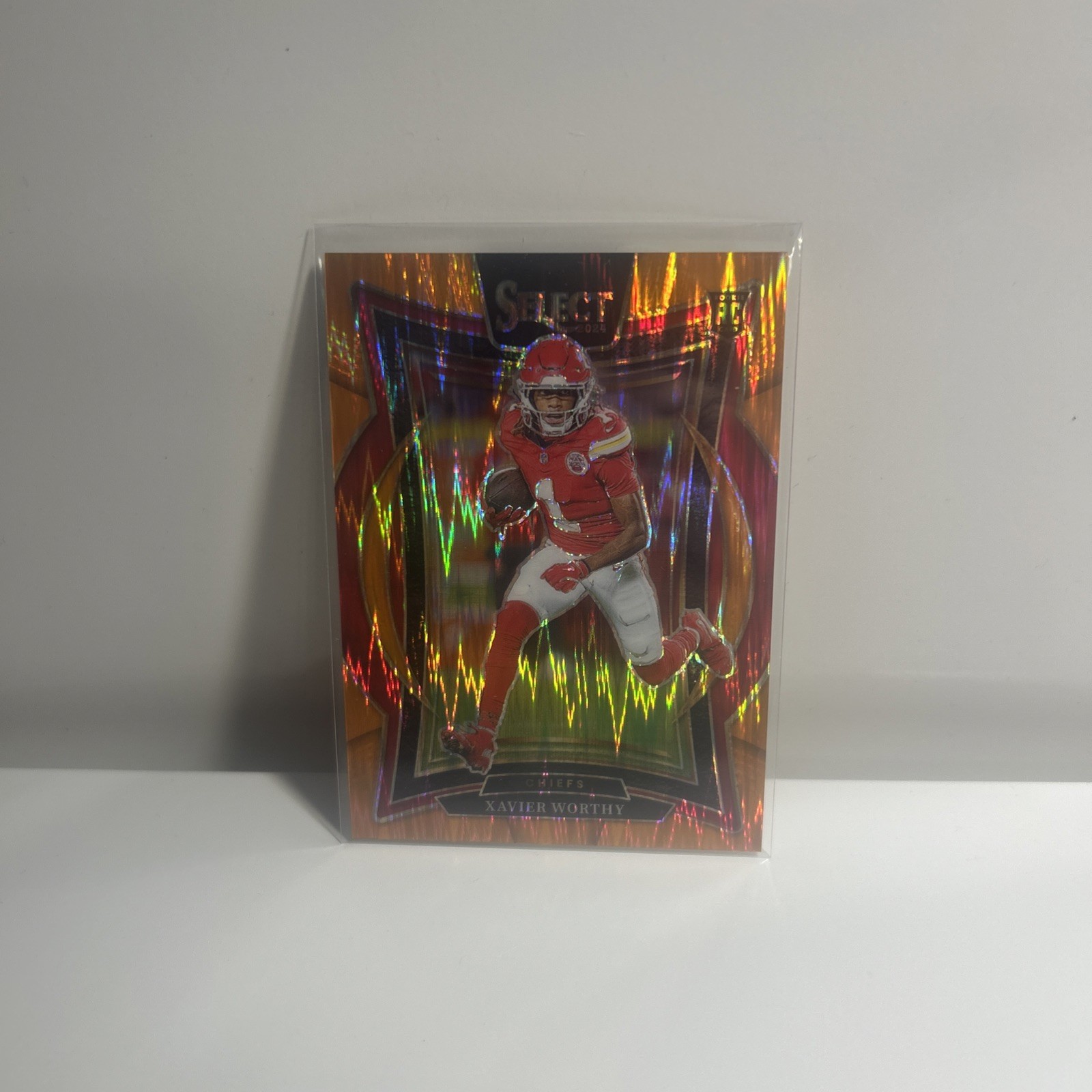 2024 Panini Select - Concourse Xavier Worthy #32 Orange Shock Prizm /499 (RC)