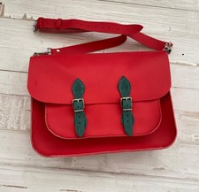 red leather satchel backpack with teal green contrast 