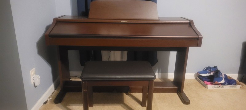 The Technics SX-PR53 is a vintage, 88-key weighted digital ensemble piano.