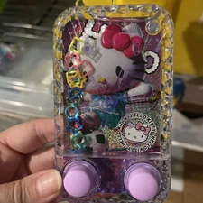 Hello Kitty Sanrio Water Ring Toss Game Handheld purple Button Pushing