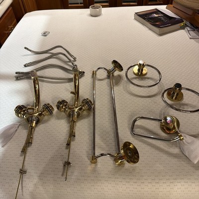 Polished Brass faucets with two types of towel and toilet paper holders