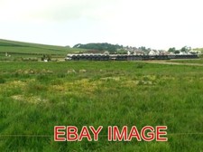 PHOTO  WRAPPING SILAGE BALES NEAR KIRKCOLM THE BALES ARE STORED ON AN AREA OF HA