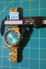 Miykon X2F24-2C10 Green Dial Gold Tone Stainless Steel Men's Watch. New w/ tag