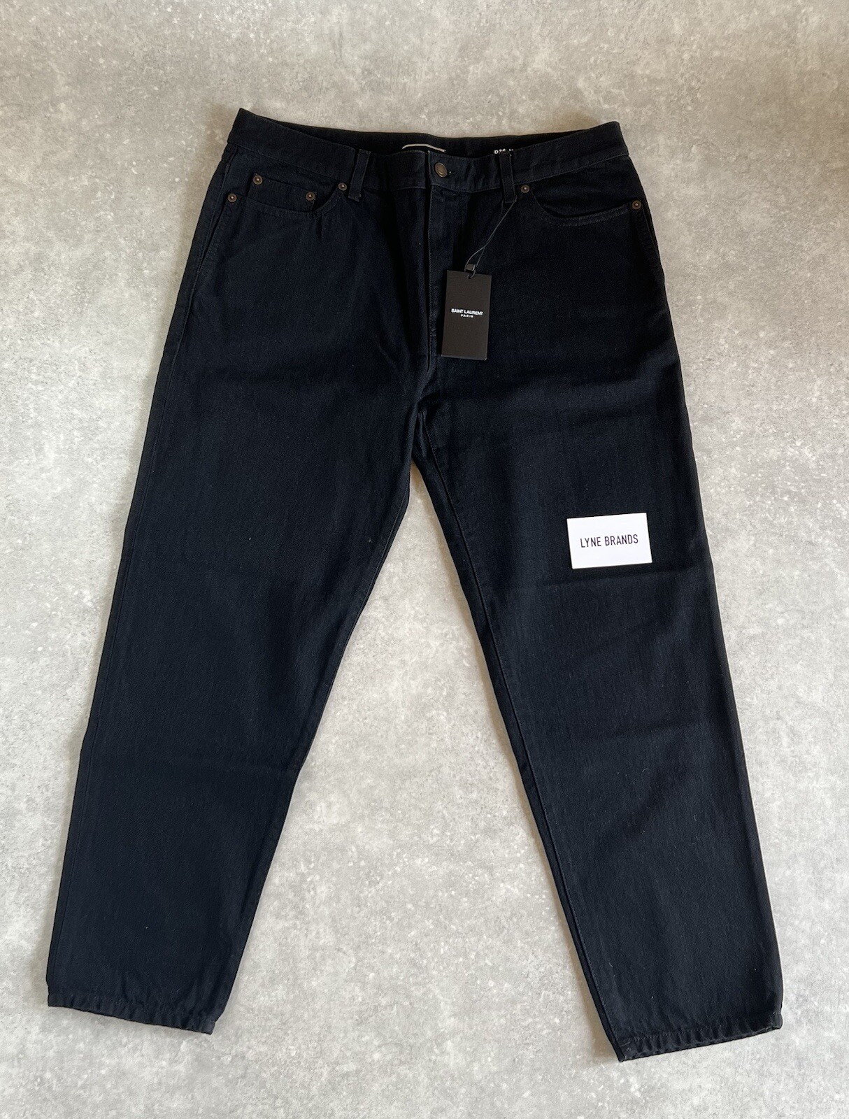 Fit carota Saint Laurent Jeans denim neri tagliati taglia W36 L28 prezzo disponibile £490