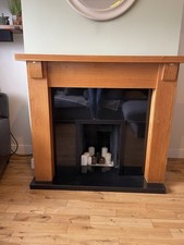 Solid Oak Fireplace Surround with Black Marble Effect Hearth.