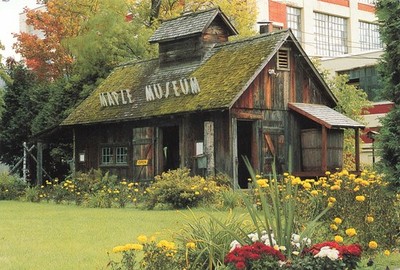 Postcard Maple Grove Farms of Vermont Syrup Sugar House Museum Flowers