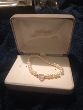 childs bracelet pearl and pink gemstone