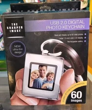 The Sharper Image Digital Photo Album w/ Keychain USB 2.0 Rechargeable