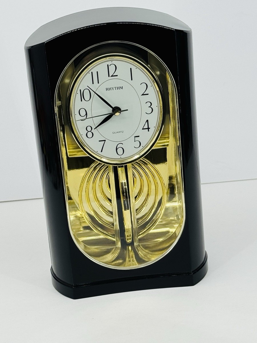 RHYTHM Hypnotic Front to Back Pendulum Mirrored Quartz Clock 10