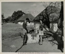 Press Photo Man and woman cooking in Kruger National Park, Union of South Africa