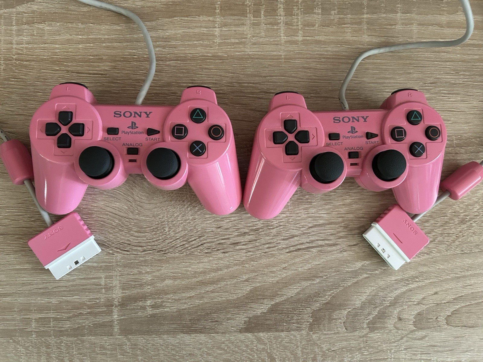 2 manettes Sony PlayStation officielles rose DualShock PS1 PS2