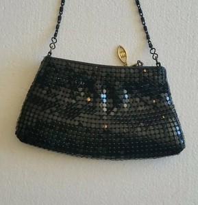 small black purse with chain strap