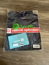 Camiseta Dua Lipa Radical Optimism 2025 exclusiva de Spotify negra mercancía talla mediana