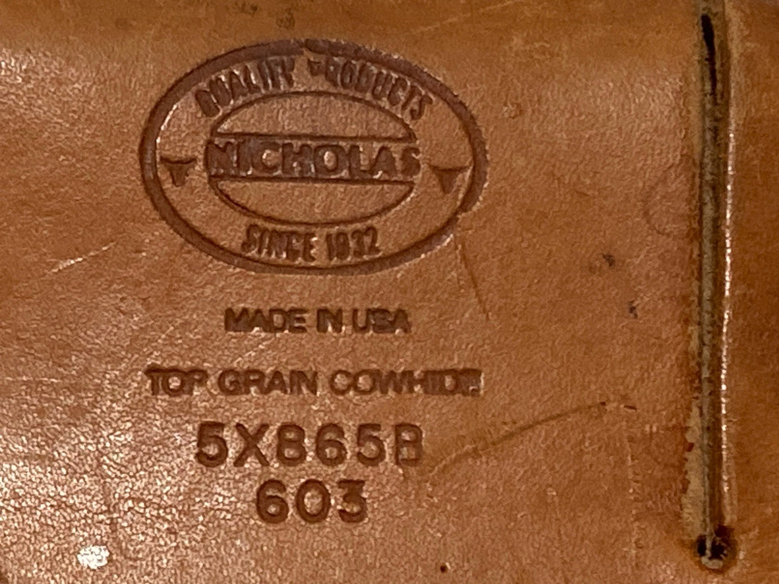 Brown leather Nicholas’ tool belt pouch with embossed logo, “5X865B 603 Made in U.S.A.”
