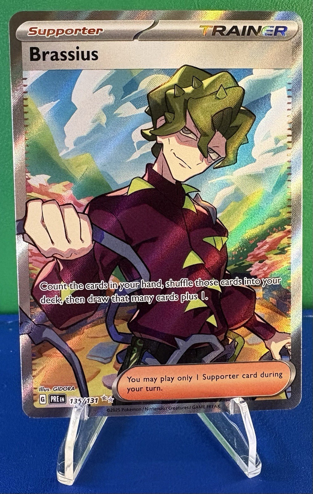 Pokémon TCG Brassius Full Art Holo 135/131 Prismatic Evolutions Trainer - NM